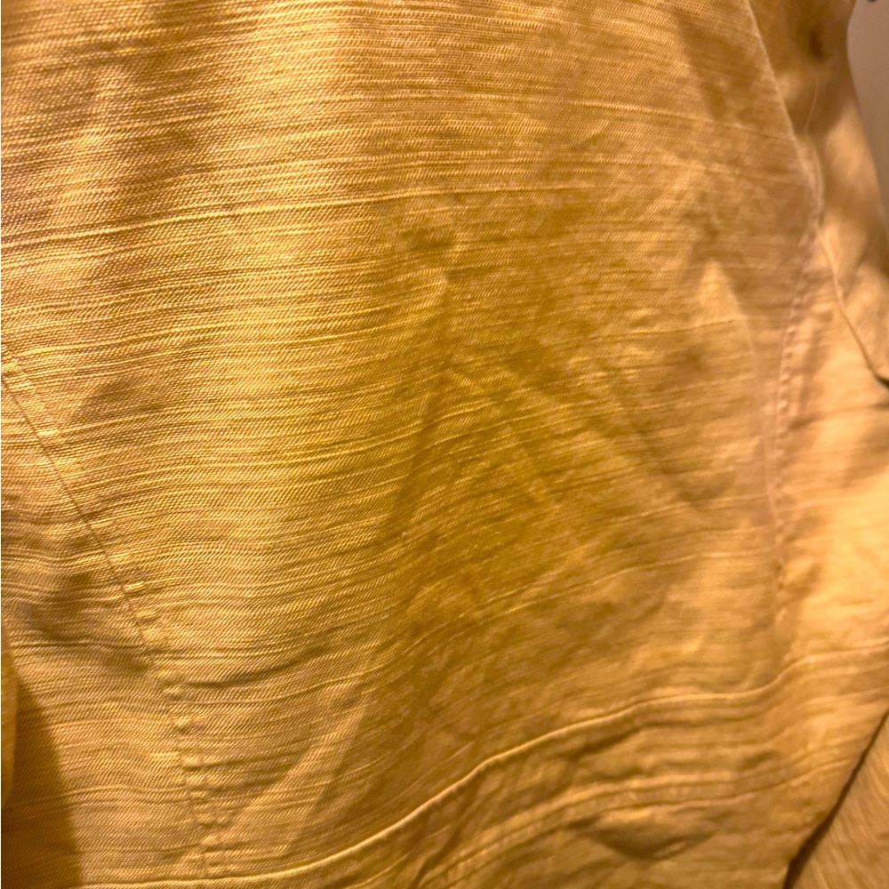 AK Skirt Suie with Gold buttons and zipper on the shirt.